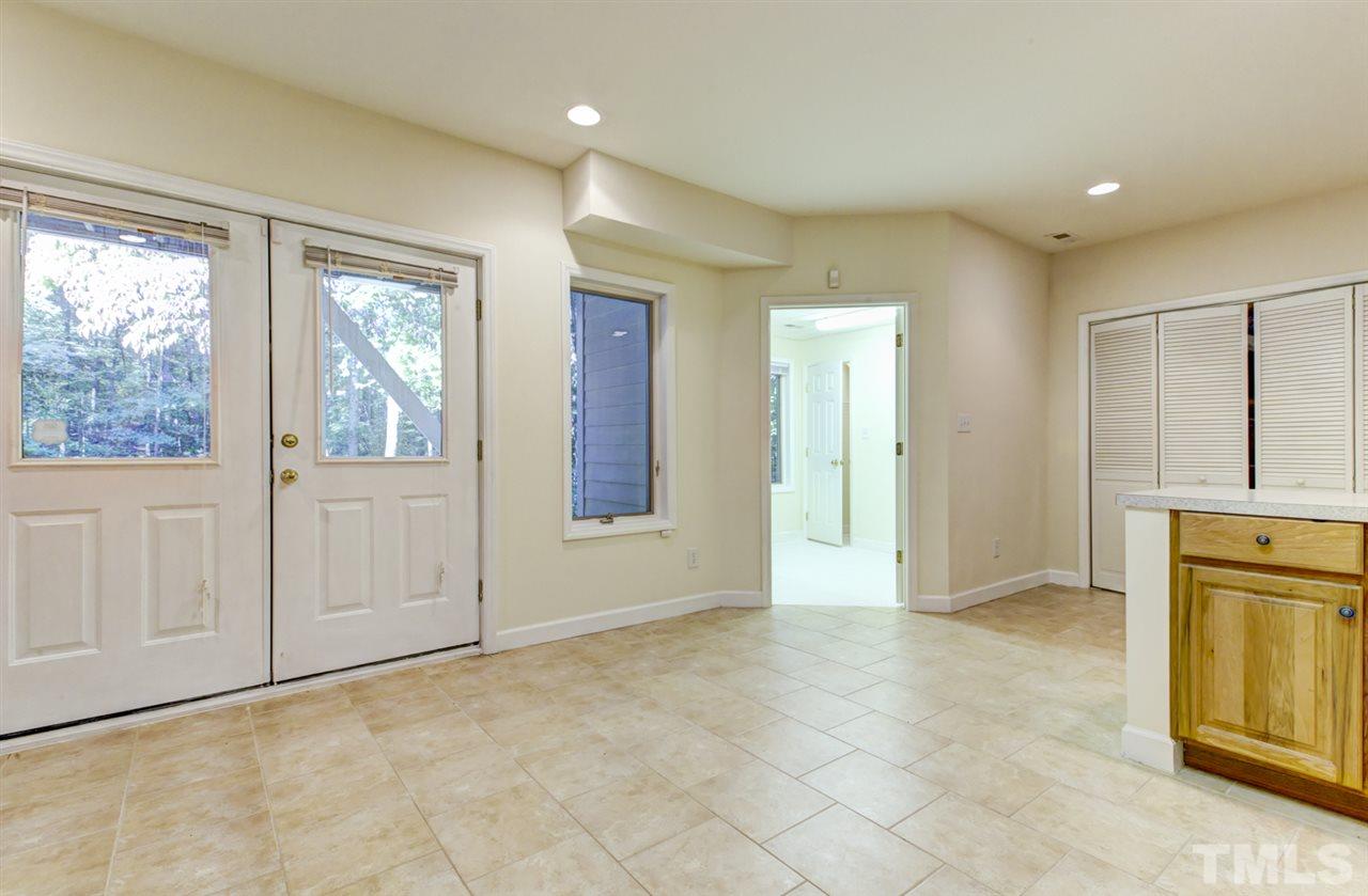 19 Covington Lane Durham, NC 27712 - Photo 22 of 30 a view of an empty room with a fireplace and a window