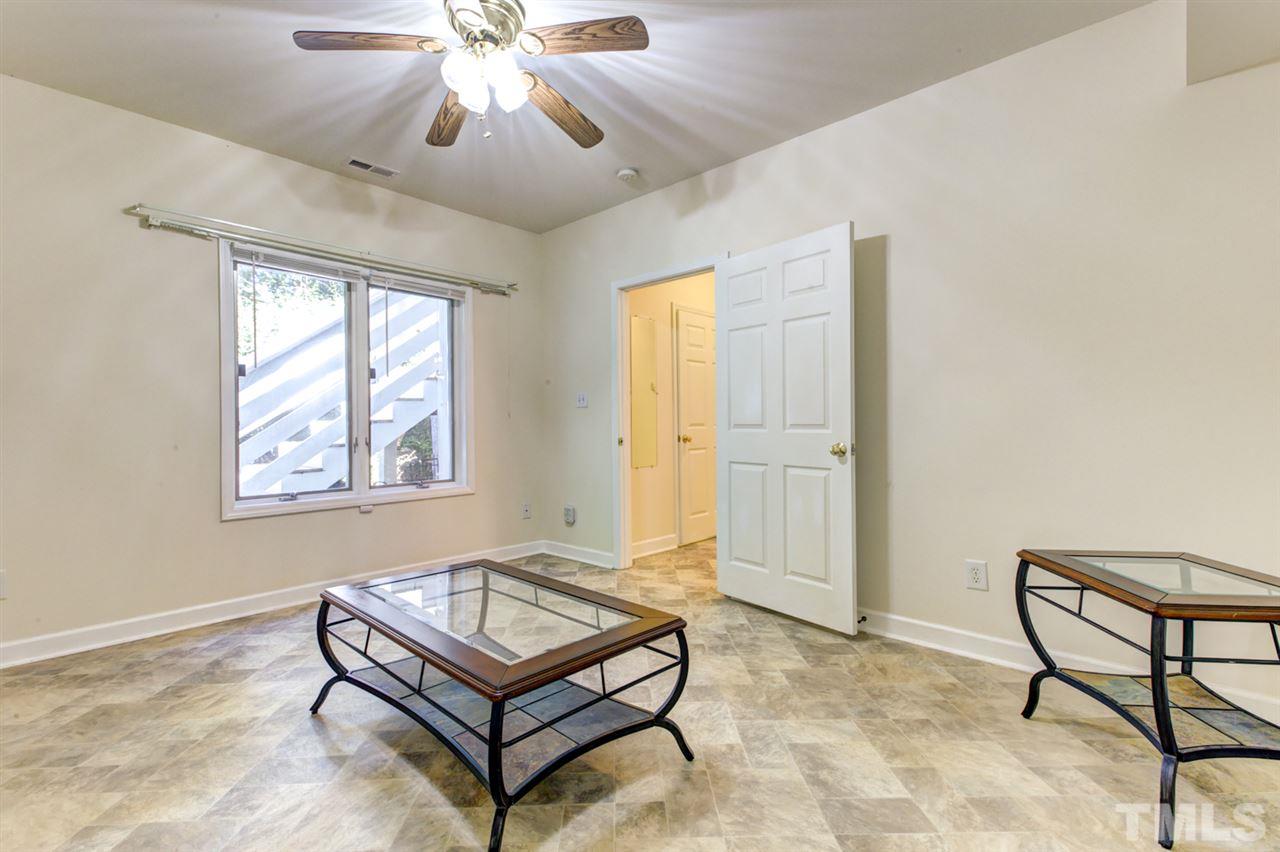 19 Covington Lane Durham, NC 27712 - Photo 25 of 30 a living room with furniture and a window