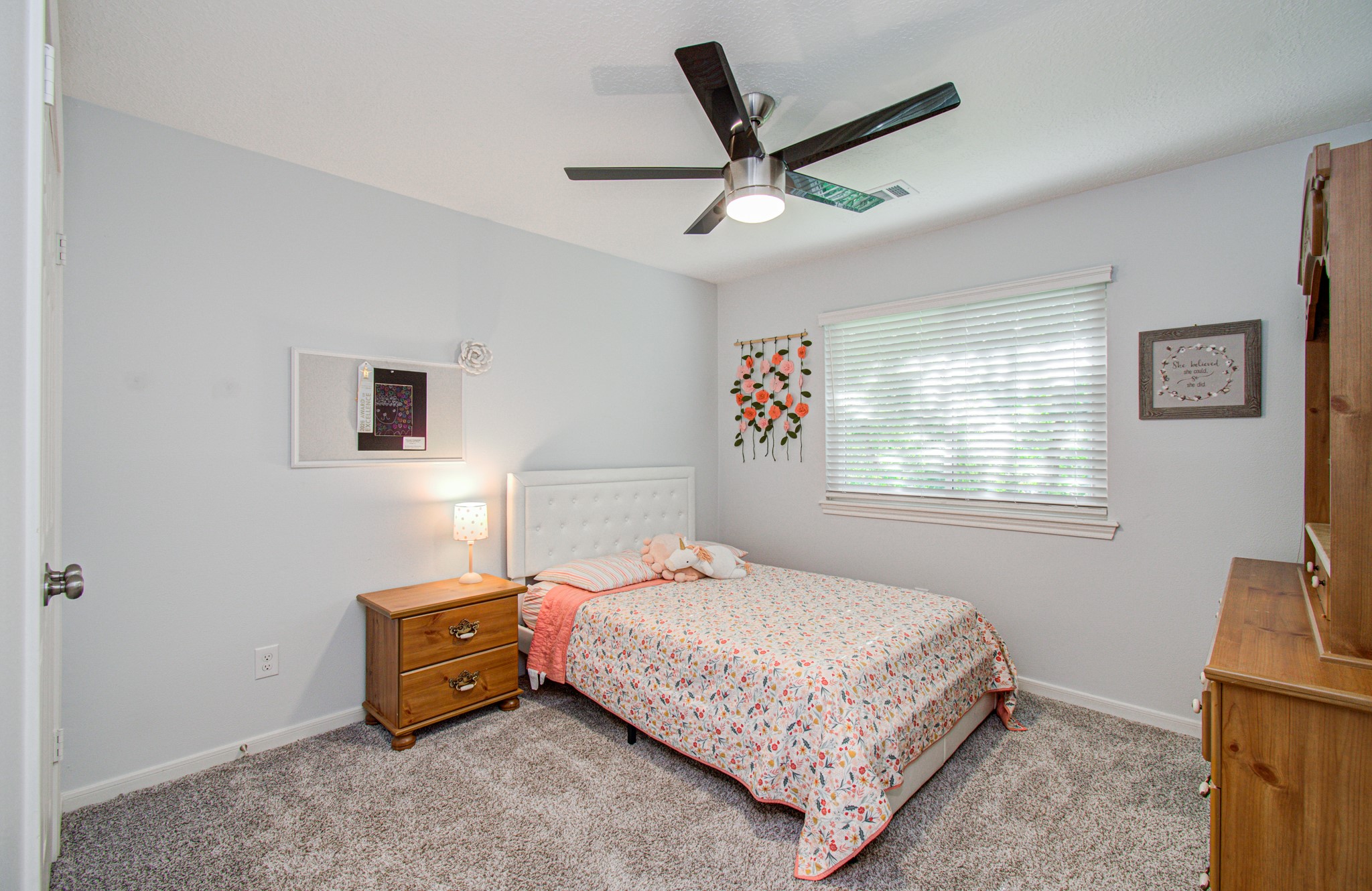 22927 Northoak Forest Lane Spring, TX 77389 - Photo 23 of 37 a bedroom with a bed a couch and a window