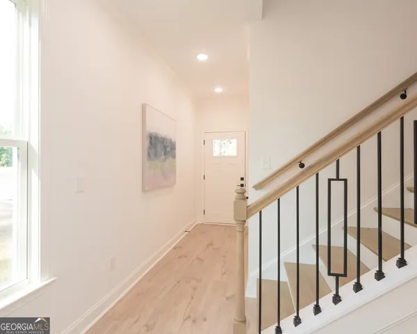 a view of a hallway with staircase