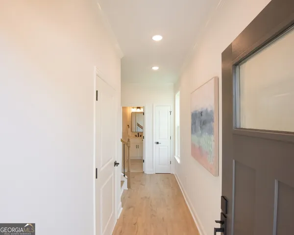 a view of hallway with furniture
