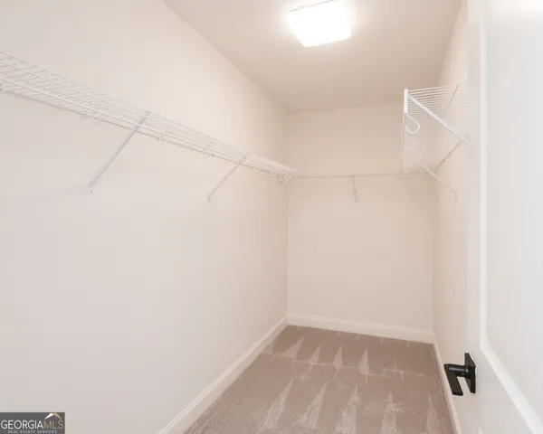 a view of a bathroom from a hallway