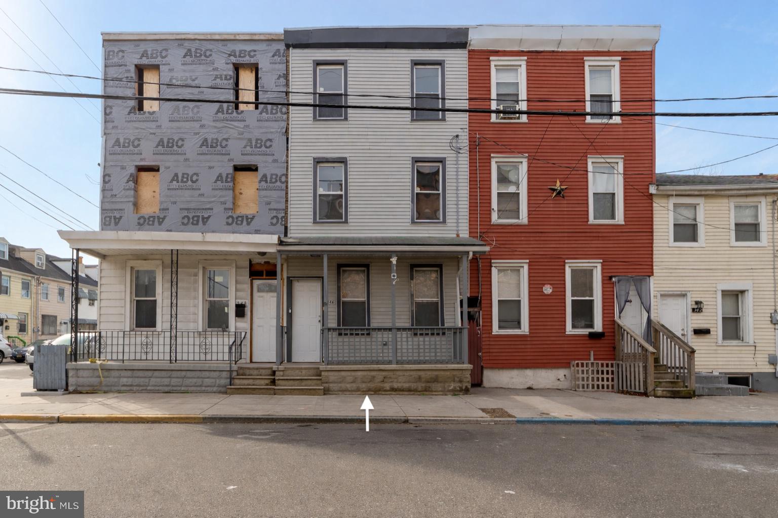 a front view of a building with a road