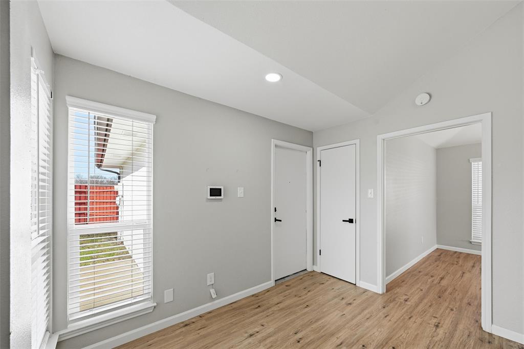 210 South Malone Road Allen, TX 75002 - Photo 13 of 36 a view of an empty room with wooden floor and a window
