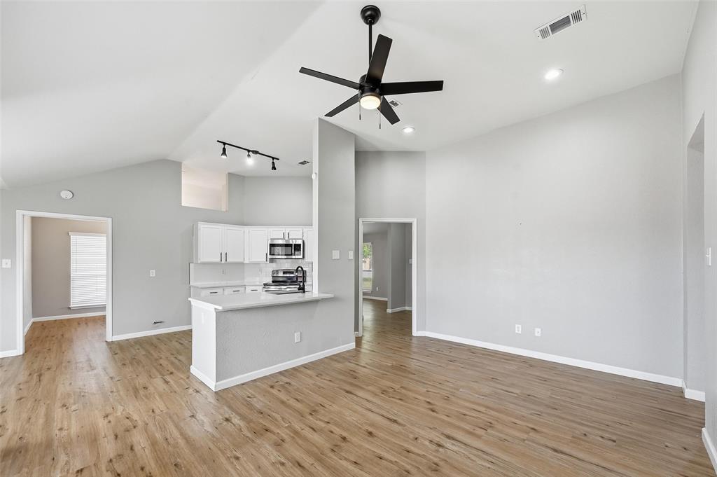 210 South Malone Road Allen, TX 75002 - Photo 32 of 36 a view of a kitchen with a sink and wooden floor
