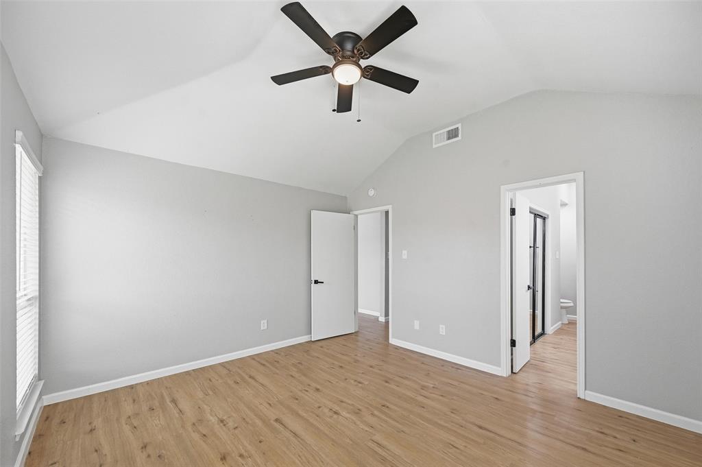 210 South Malone Road Allen, TX 75002 - Photo 17 of 36 an empty room with wooden floor and ceiling fan