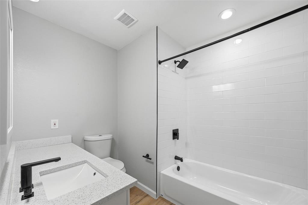 210 South Malone Road Allen, TX 75002 - Photo 18 of 36 a bathroom with a sink a toilet and shower