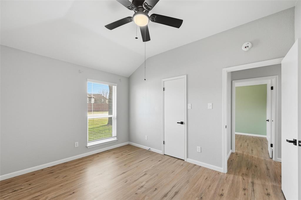 210 South Malone Road Allen, TX 75002 - Photo 22 of 36 wooden floor in an empty room with a window