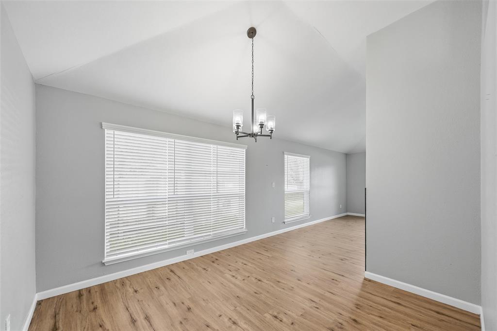 210 South Malone Road Allen, TX 75002 - Photo 9 of 36 a view of empty room with wooden floor and fan