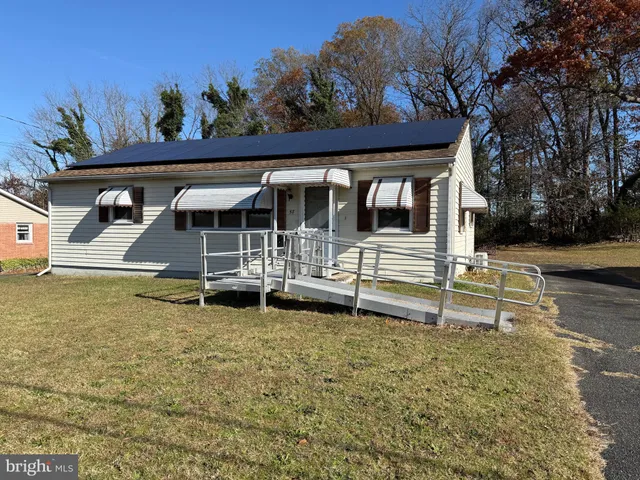 a house with trees in the background