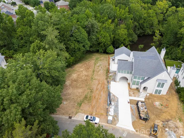 an aerial view of a house with yard