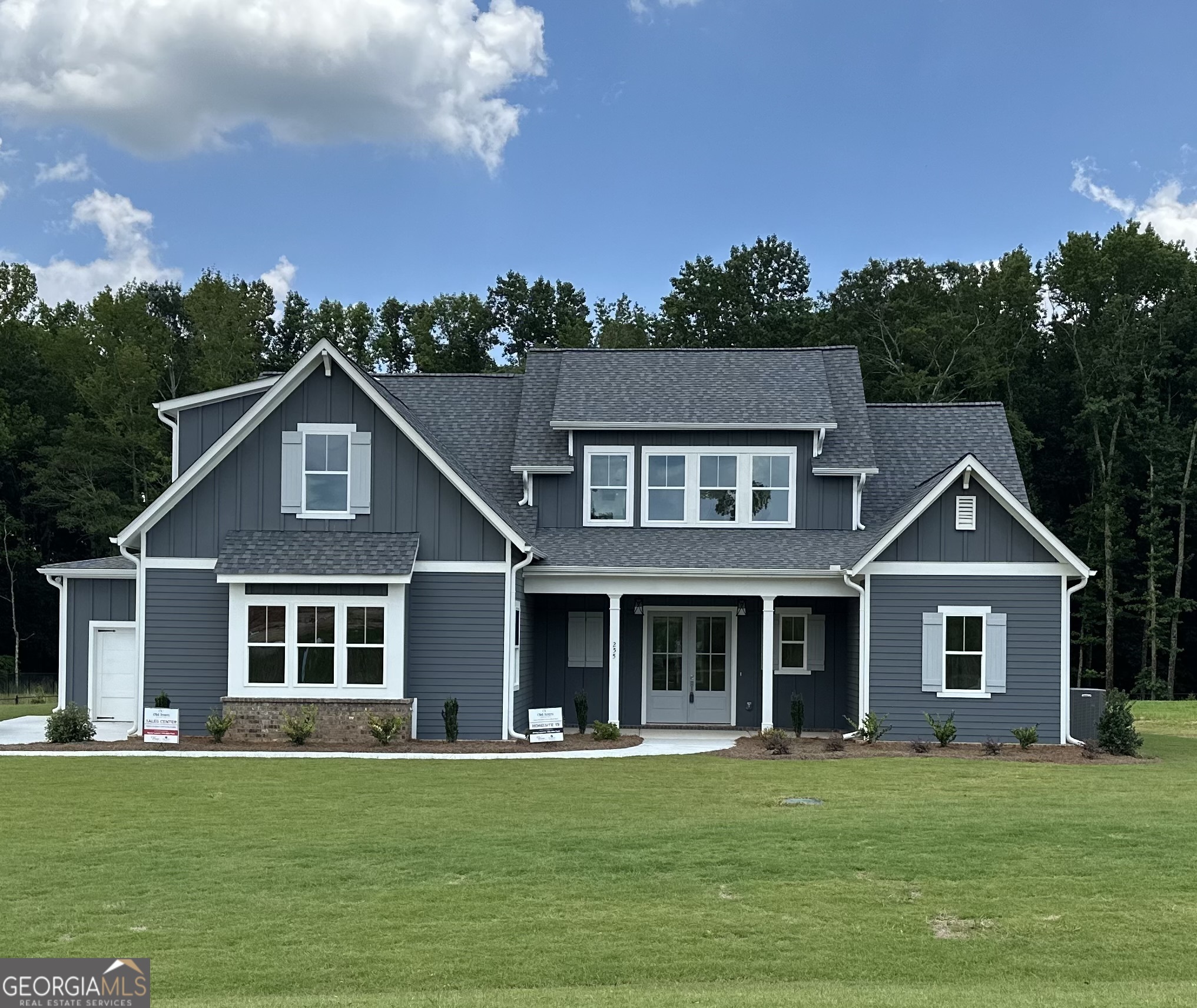 front view of a house with a yard
