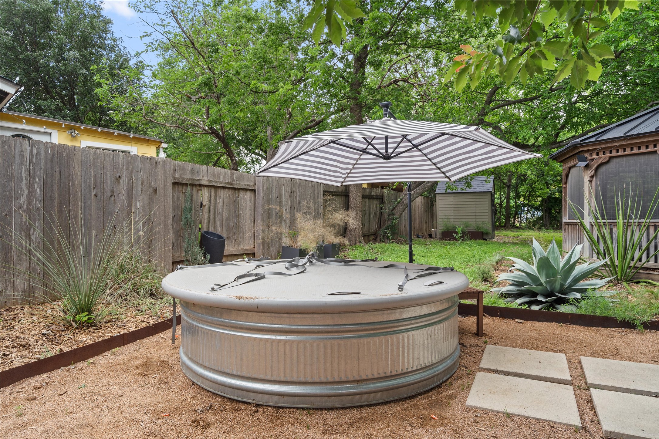 8436 Bangor Bend Austin, TX 78758 - Photo 26 of 29 A cowboy pool brings the fun, while the surrounding gravel and native-style landscaping keep the vibe low-key and easy.