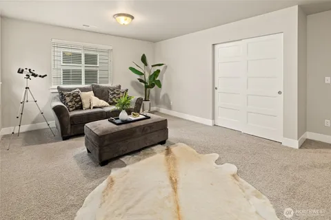 a living room with furniture and windows