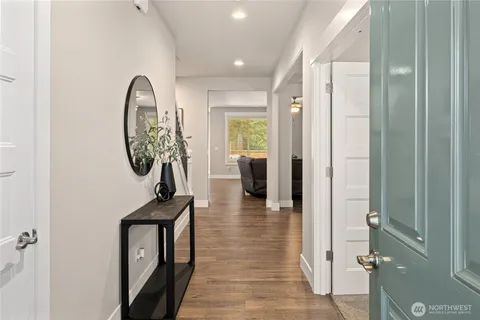 workspace with wooden floor mirror and windows