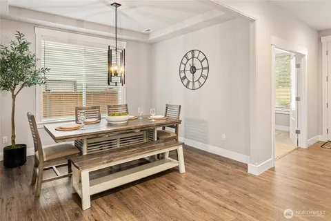 a view of room with a table and a potted plant