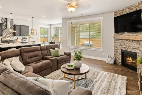 a living room with furniture fireplace and flat screen tv