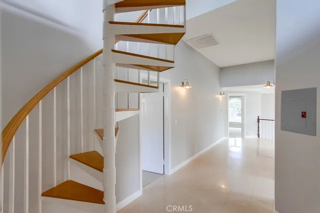 a view of an empty room with a fireplace