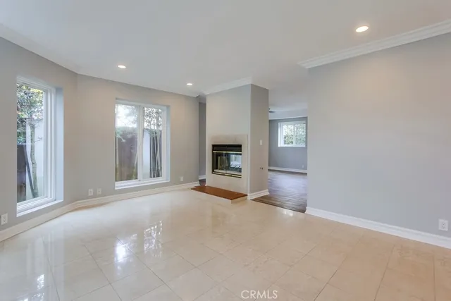 a view of a room window and fire place