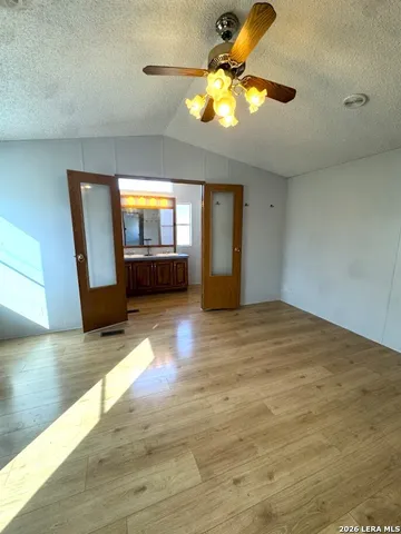 a view of a porch with furniture and backyard