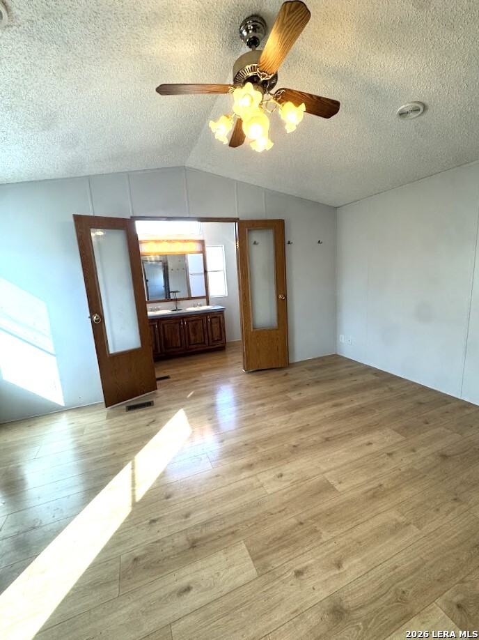 2057 Indian Hills Drive Spring Branch, TX 78070 - Photo 5 of 15 wooden floor in an empty room with a window