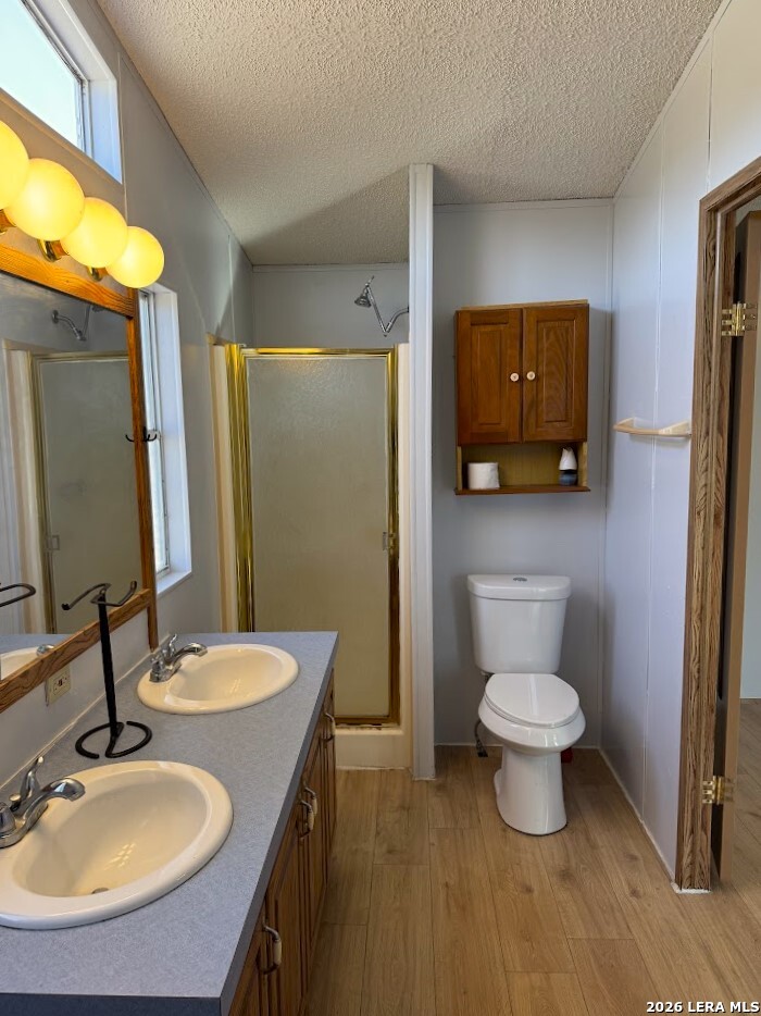 2057 Indian Hills Drive Spring Branch, TX 78070 - Photo 6 of 15 a bathroom with a sink toilet and mirror