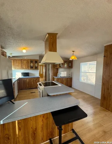 a kitchen with stainless steel appliances granite countertop a sink counter space and cabinets