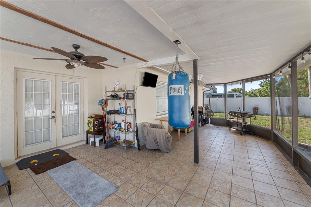8715 Huntsman Lane Port Richey, FL 34668 - Photo 44 of 54 a view of a livingroom with furniture and floor to ceiling window