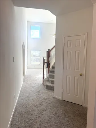 a view of hallway with livingroom