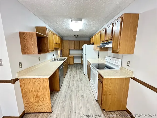 a bathroom with a sink a mirror and shower