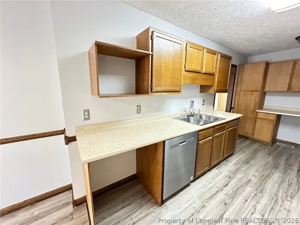 a spacious bathroom with a double vanity sink and a mirror