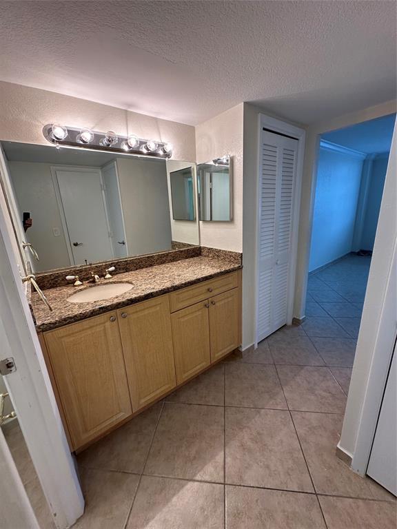 1900 South Ocean Boulevard, Unit 7J Lauderdale-by-the-Sea, FL 33062 - Photo 13 of 30 a room with washing machine