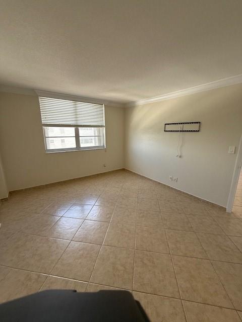 1900 South Ocean Boulevard, Unit 7J Lauderdale-by-the-Sea, FL 33062 - Photo 6 of 30 an empty room with a empty space and windows