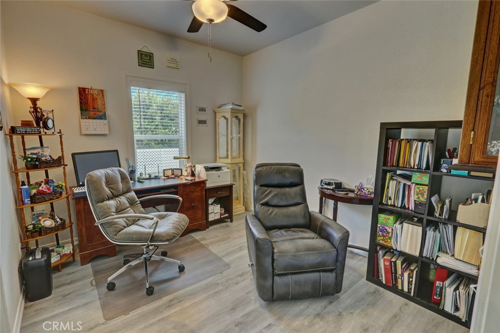 22221 Bloomfield Street, Unit 47 Cypress, CA 90630 - Photo 12 of 30 a living room with furniture and a book shelf