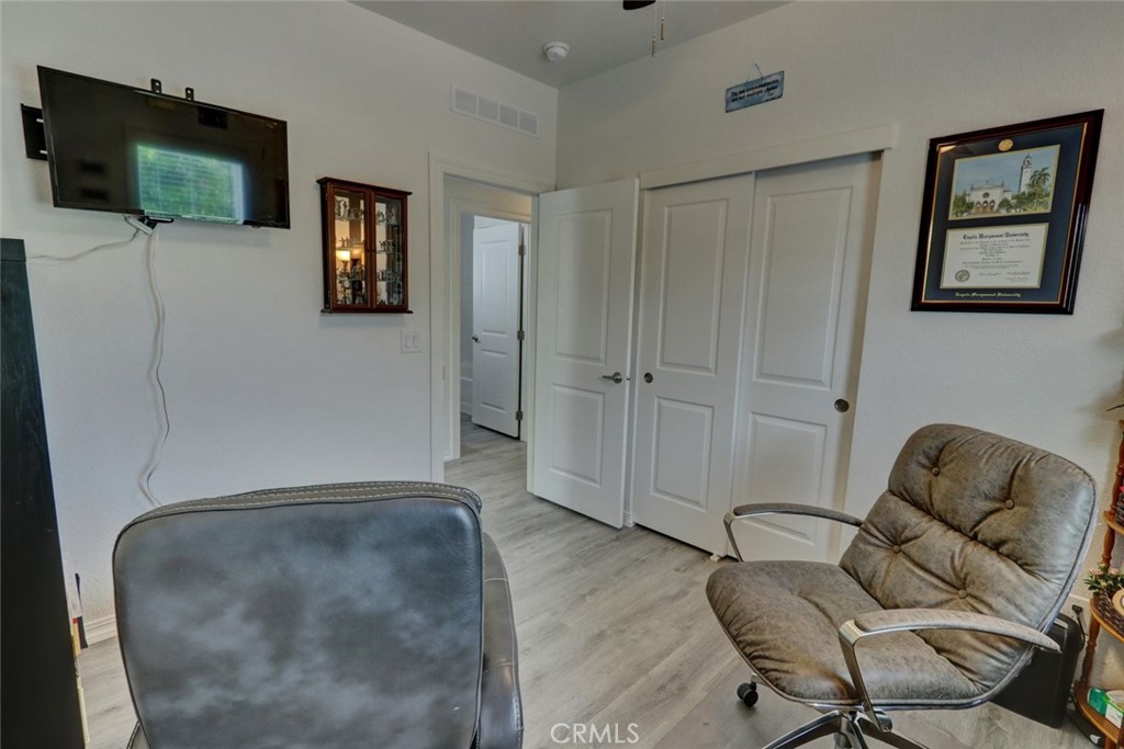 22221 Bloomfield Street, Unit 47 Cypress, CA 90630 - Photo 13 of 30 a living room with furniture and a flat screen tv
