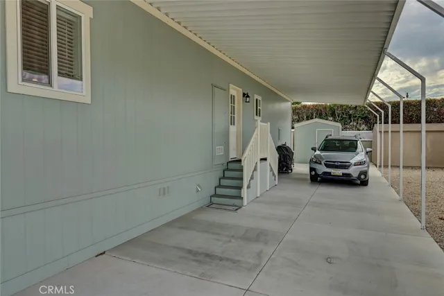 a bathroom with a granite countertop sink a shower and a mirror