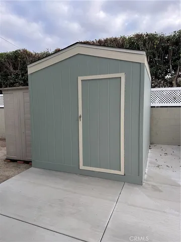 a view of a car garage both side of a road