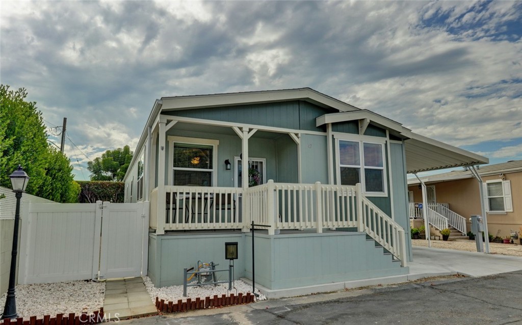 22221 Bloomfield Street, Unit 47 Cypress, CA 90630 - Photo 21 of 30 a front view of a house with garden