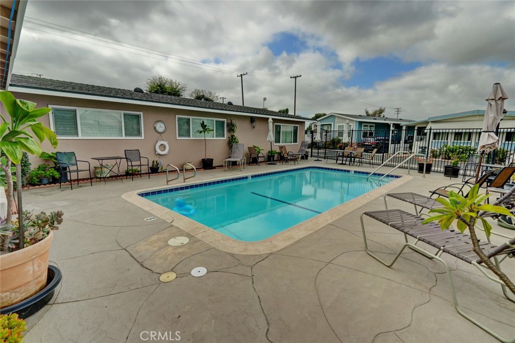 22221 Bloomfield Street, Unit 47 Cypress, CA 90630 - Photo 22 of 30 a view of a house with swimming pool and sitting area