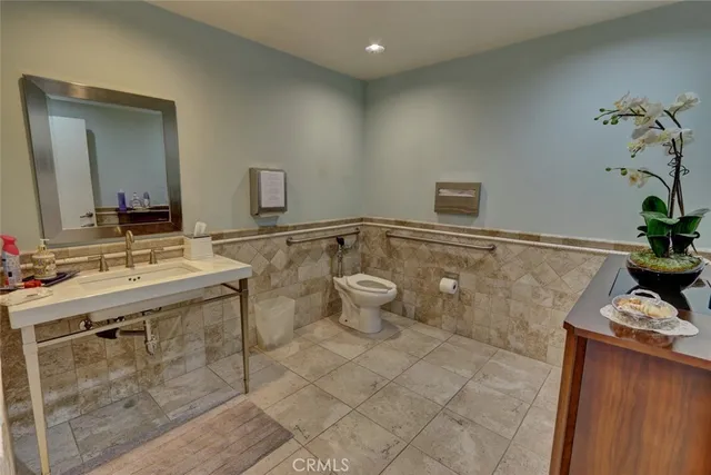 a kitchen with sink cabinets and stainless steel appliances