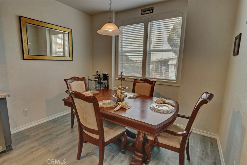 22221 Bloomfield Street, Unit 47 Cypress, CA 90630 - Photo 7 of 30 a view of a dining room with furniture and window