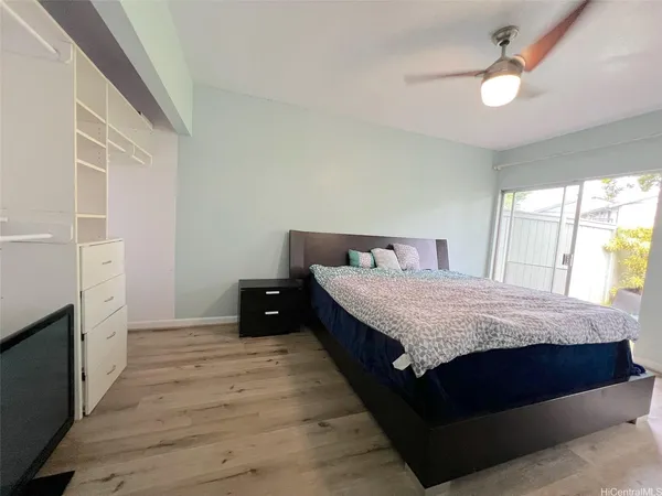 a bedroom with a bed and a dresser