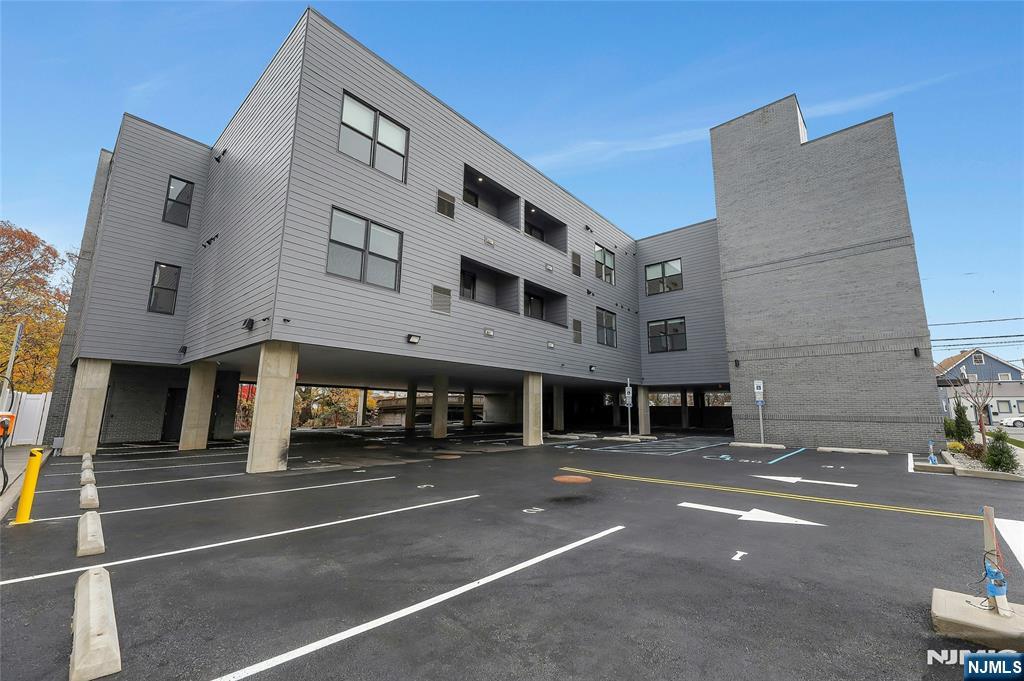 255 Ridge Road, Unit 201 Lyndhurst, NJ 07071 - Photo 3 of 24 a tall building sitting on the side of a street