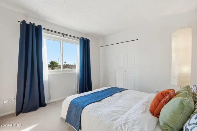 a view of a patio with a dining table and chairs with outer view