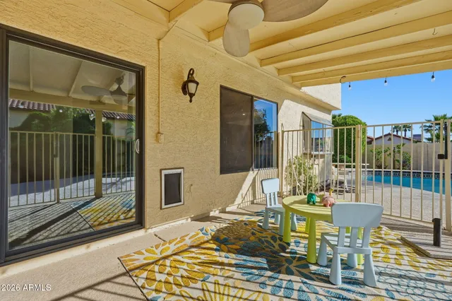 a view of a backyard with plants and a patio