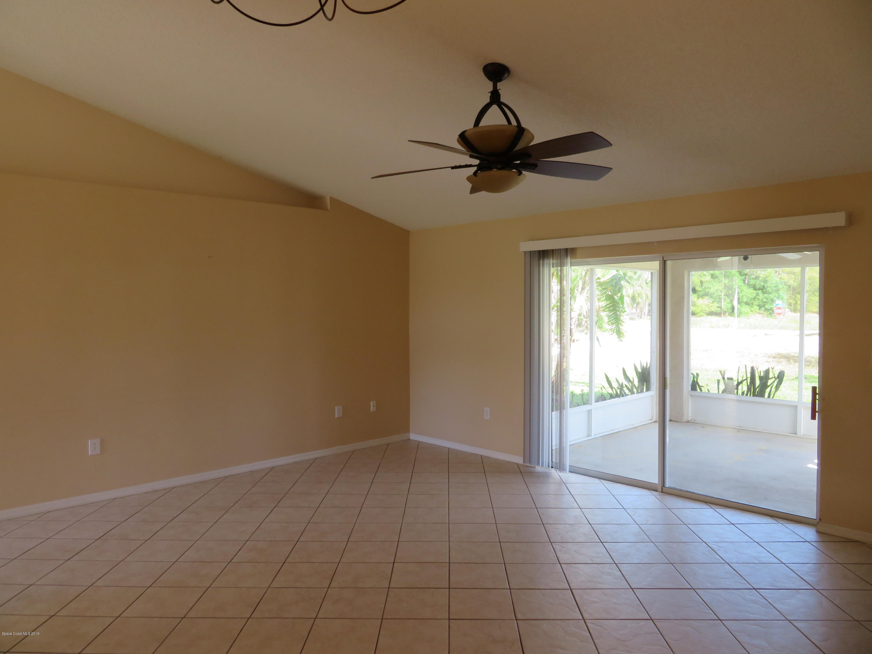 801 Clifton Road Southeast Palm Bay, FL 32909 - Photo 2 of 25 a view of an empty room with a window