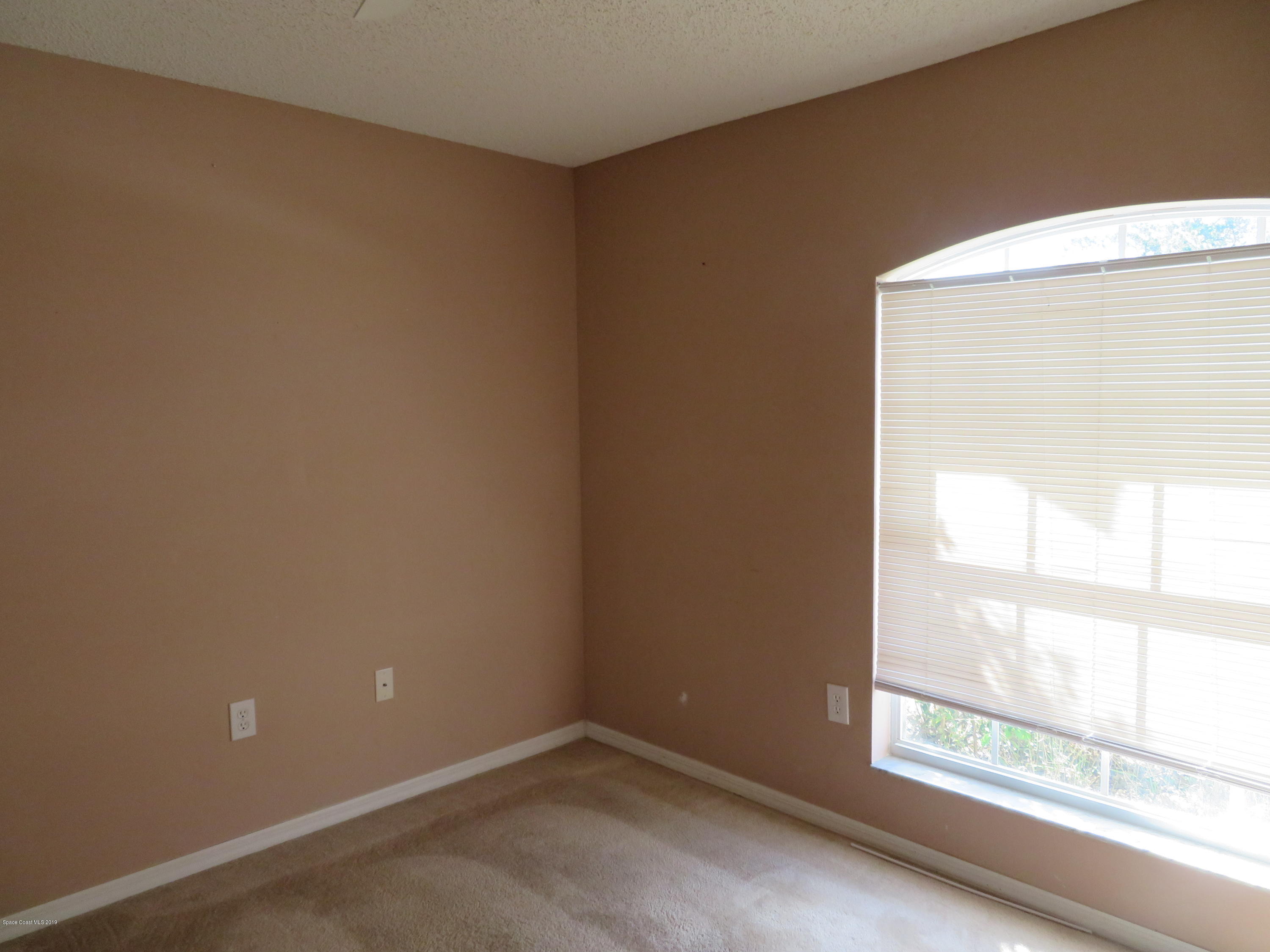 801 Clifton Road Southeast Palm Bay, FL 32909 - Photo 15 of 25 an empty room with a window