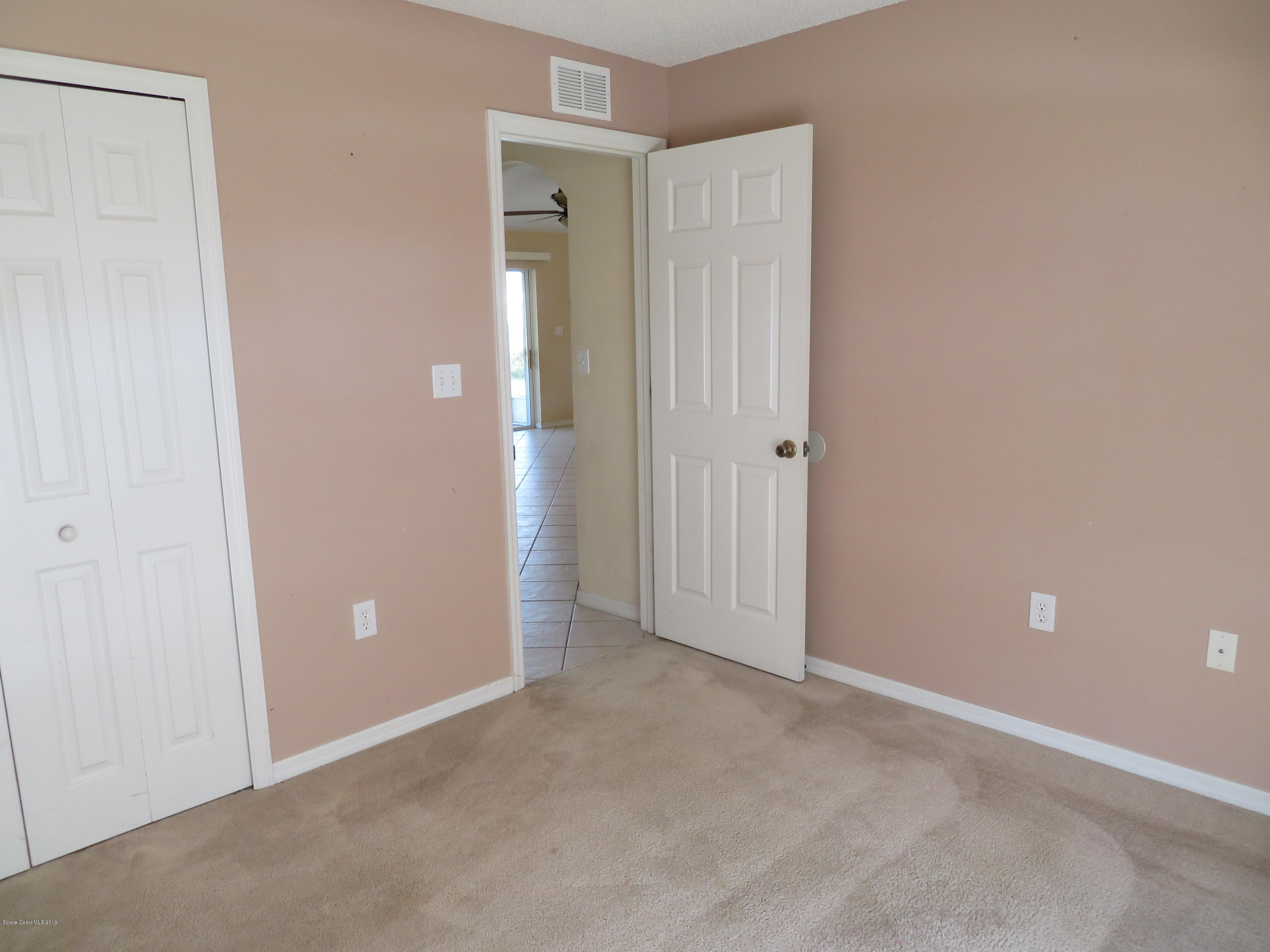 801 Clifton Road Southeast Palm Bay, FL 32909 - Photo 16 of 25 a view of an empty room with closet area