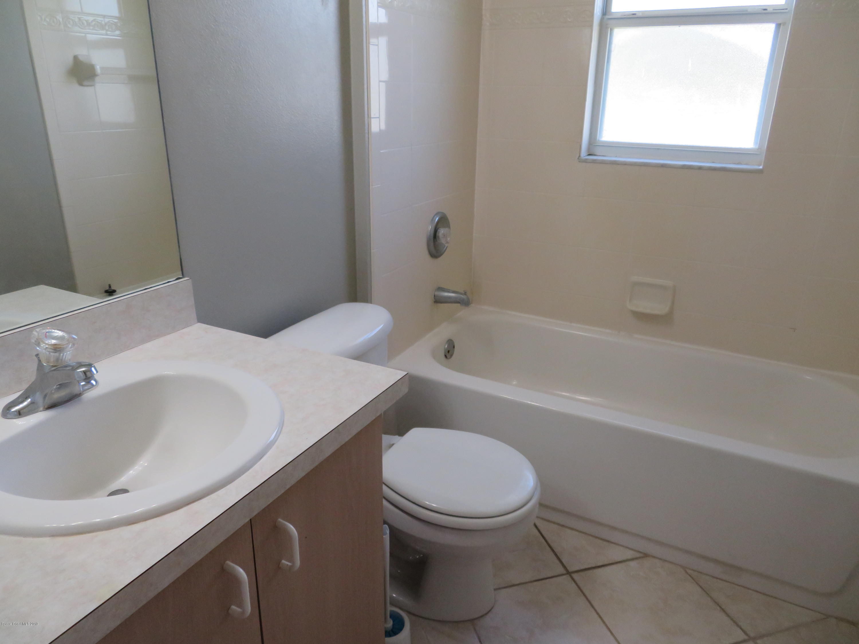 801 Clifton Road Southeast Palm Bay, FL 32909 - Photo 20 of 25 a bathroom with a sink a toilet and bathtub