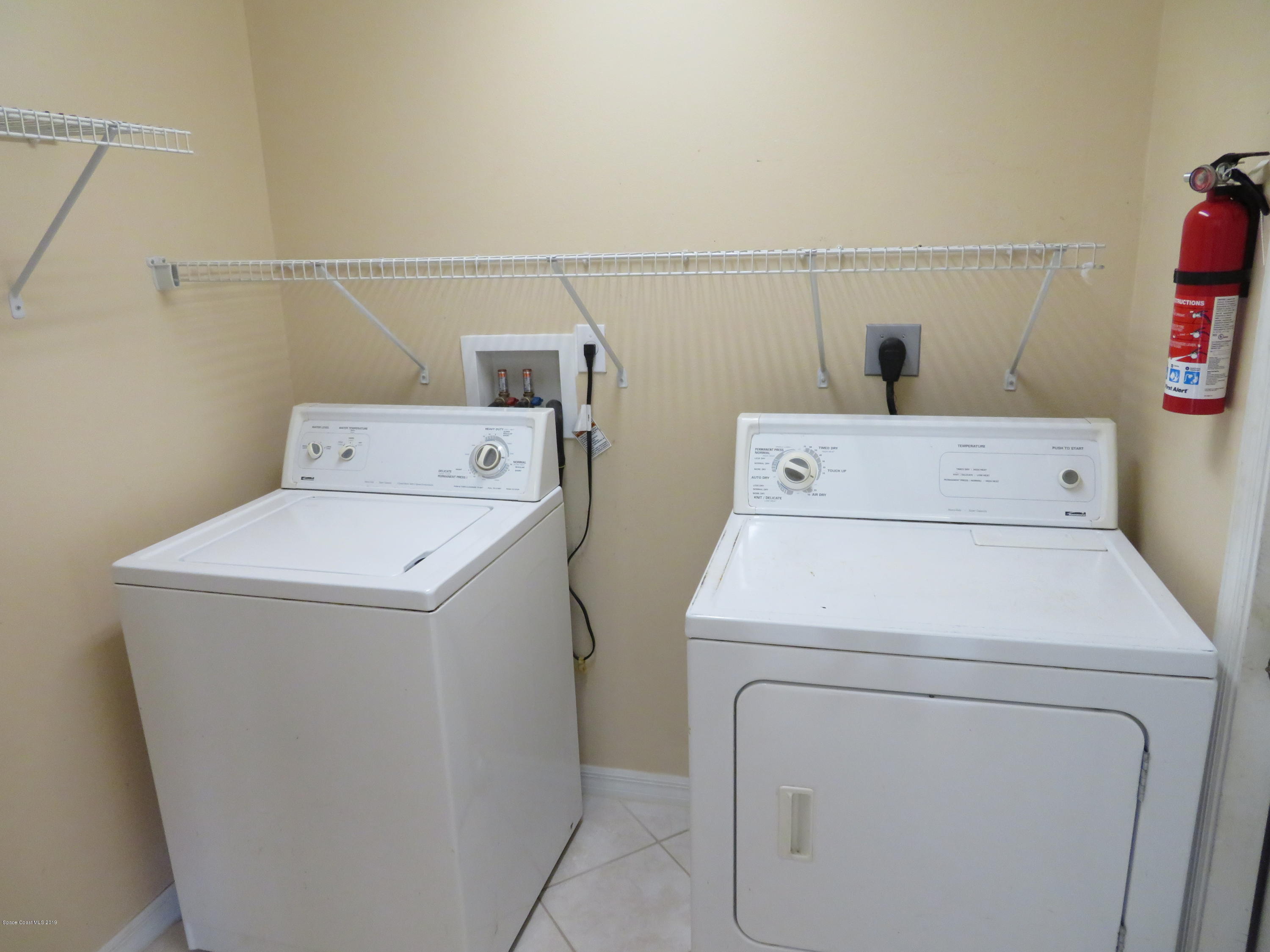 801 Clifton Road Southeast Palm Bay, FL 32909 - Photo 21 of 25 a utility room with dryer and washer